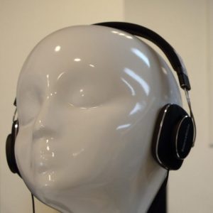 Mannequin Listening to Strong Voice on Headphones