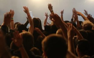 Crowd with Raised Hands