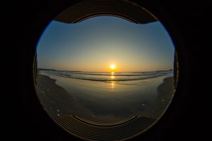 Glass Orb Sandbox with Sunrise over Ocean