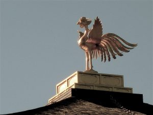 Phoenix Statue on Roof Giving Voice to the Rising Sun