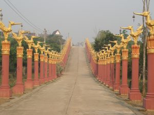 Road into the Distance Lined with Pillars Each Topped with a Phoenix Statue