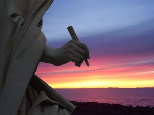 Statue of Writer Backlit by Sunrise