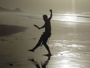 Slim Guy Dancing on Beach